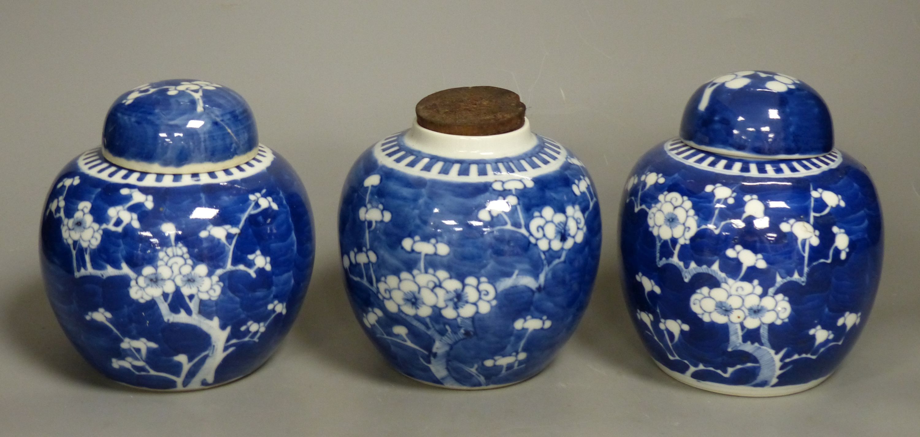 Three Chinese blue and white prunus jars, late 19th century/early 20th century